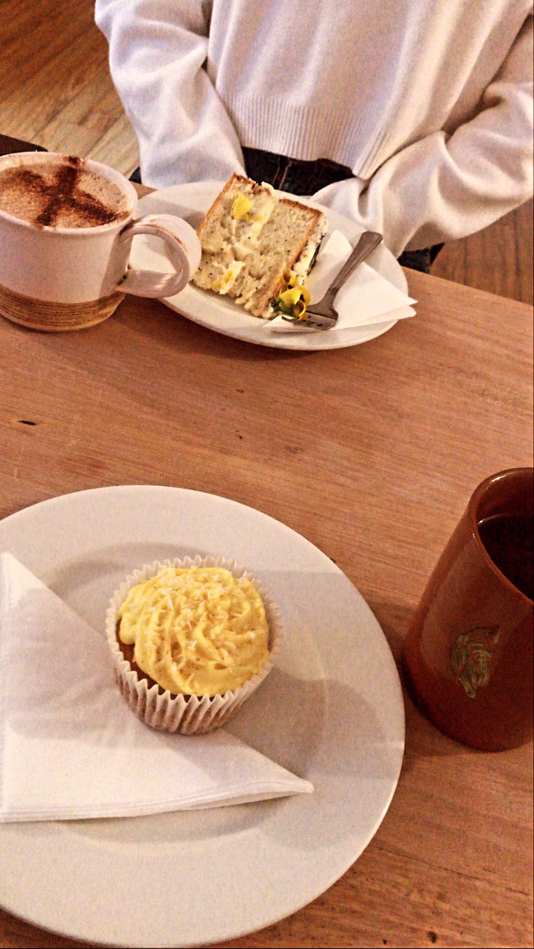 Cakes and coffees photographed on a table in Thrive Cafe.