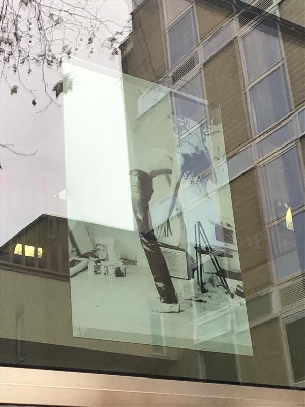 A Syd Barrett poster hanging in the window of the Coslett building at Anglia Ruskin.