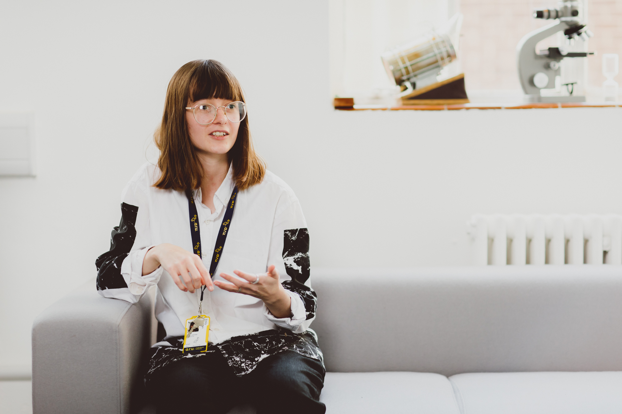 Lecturer Emily Godden sitting at a desk in a computer lab