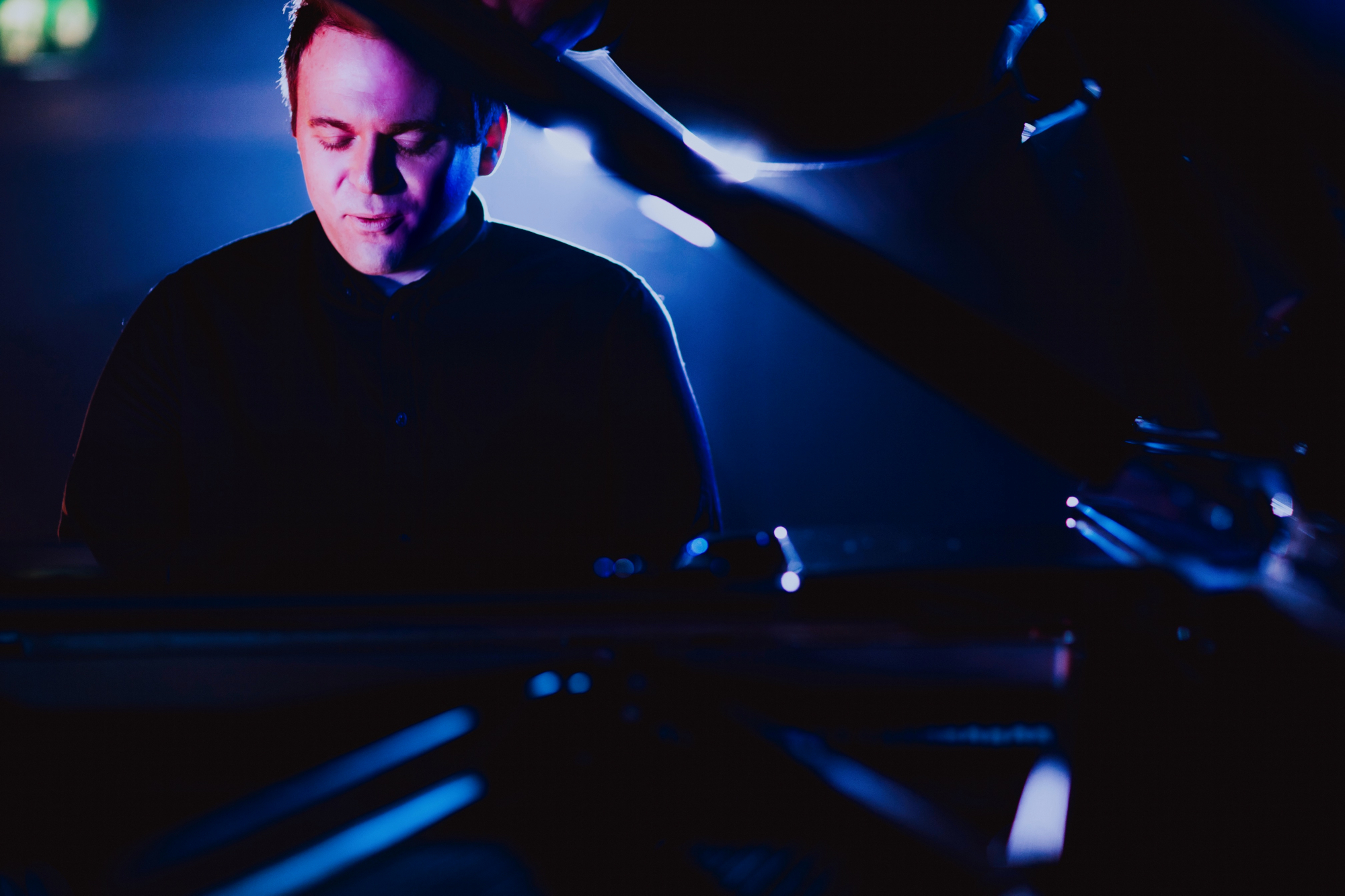 Close up of Musical Theatre lecturer Ryan Murphy playing a piano that is out of shot