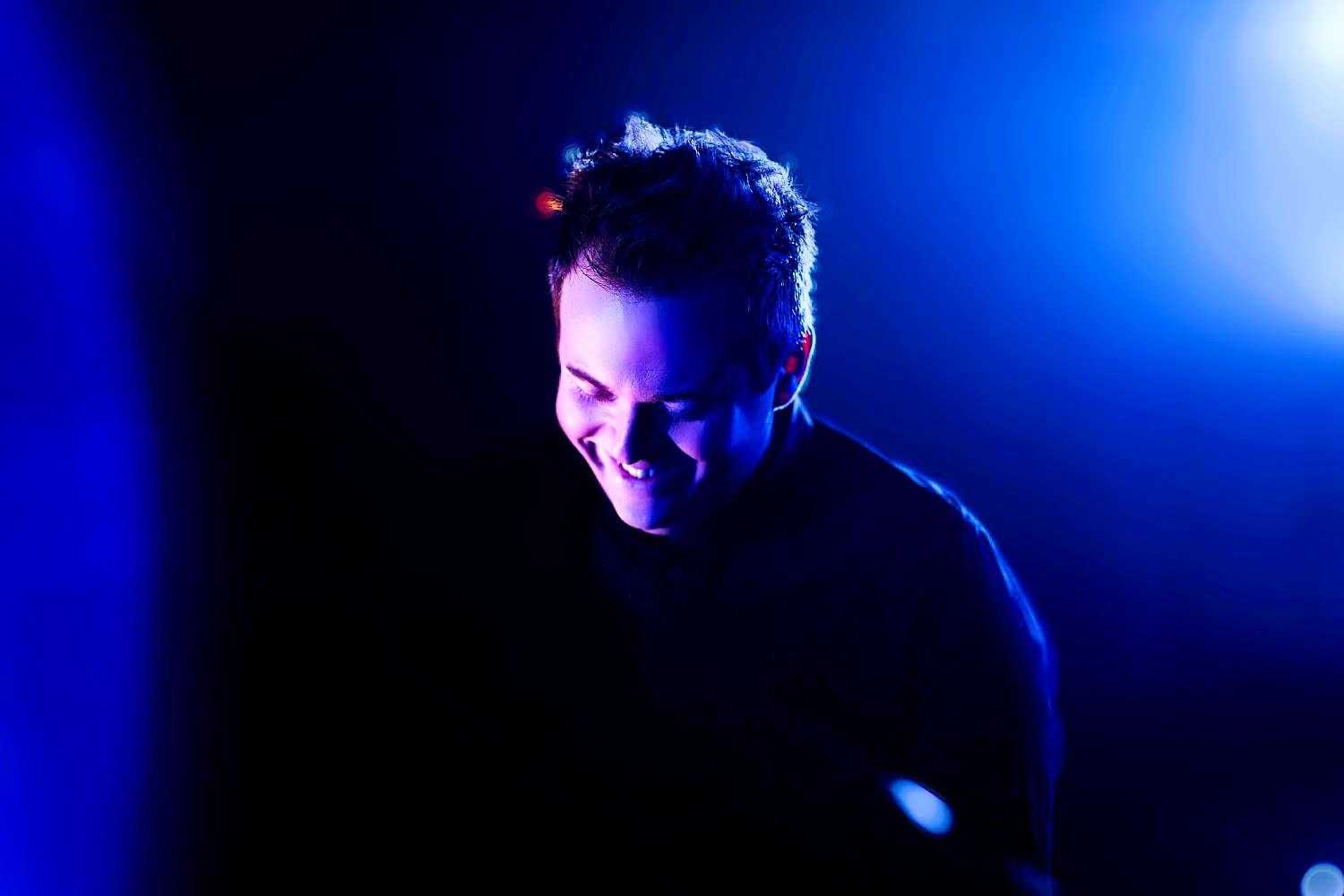 Close up of Musical Theatre lecturer Ryan Murphy playing a piano that is out of shot