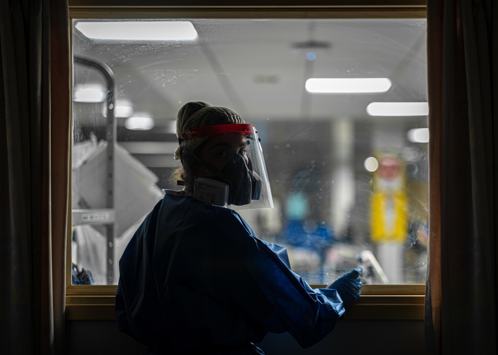 A staff member pictured wearing a face mask.