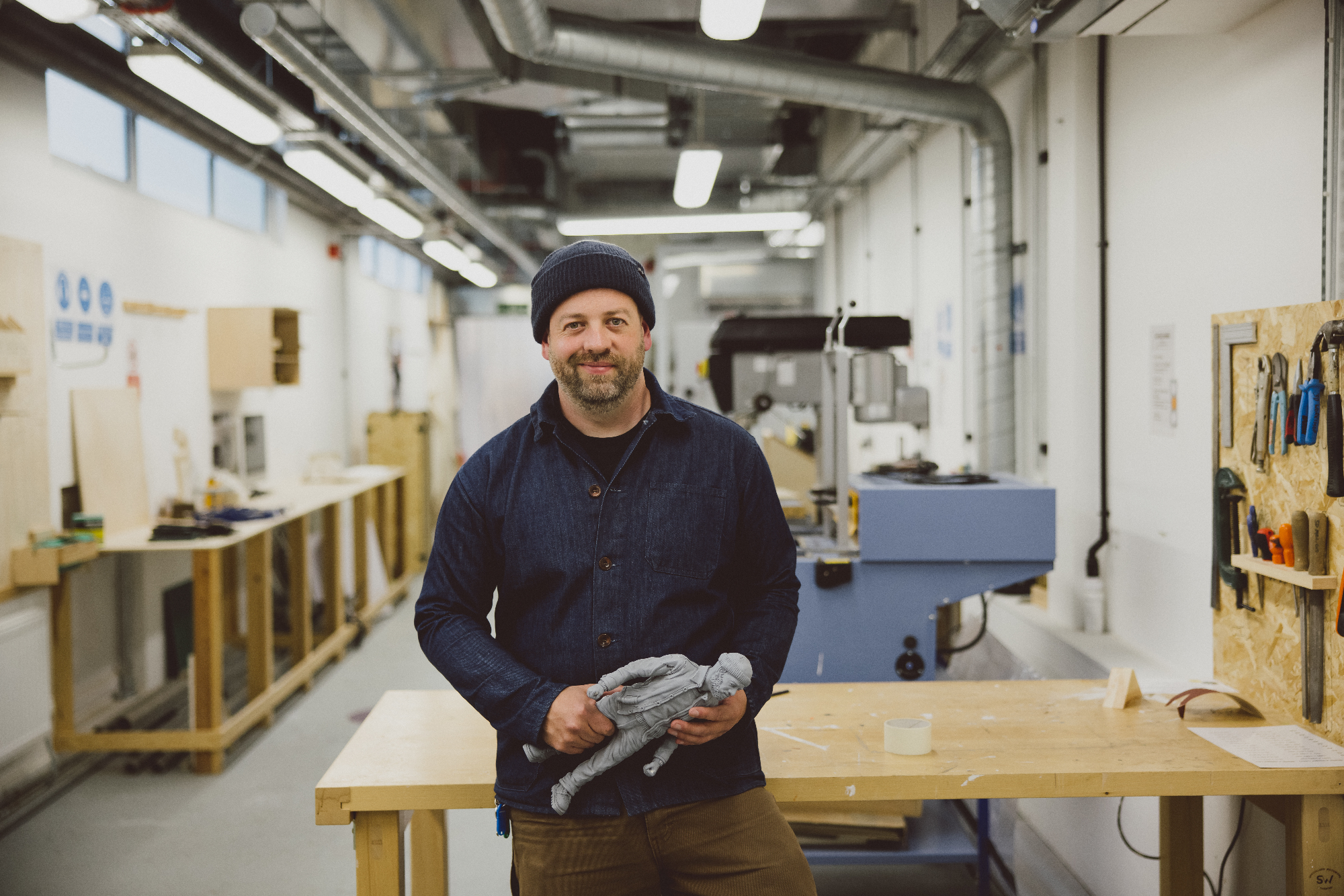 Andy McDowall in 3D workshop with small 3D model of himself