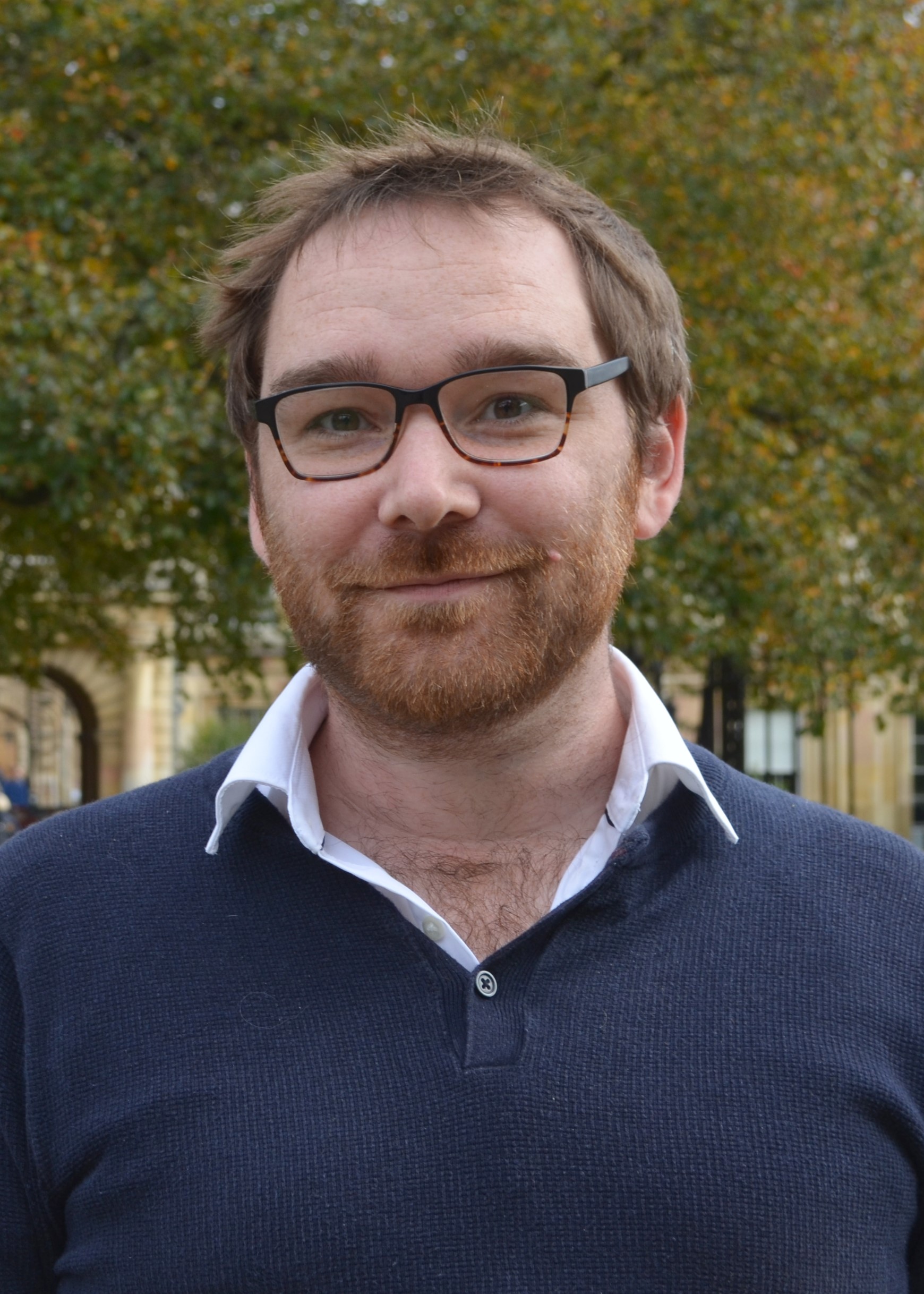 A headshot photo of Ian Burrows.
