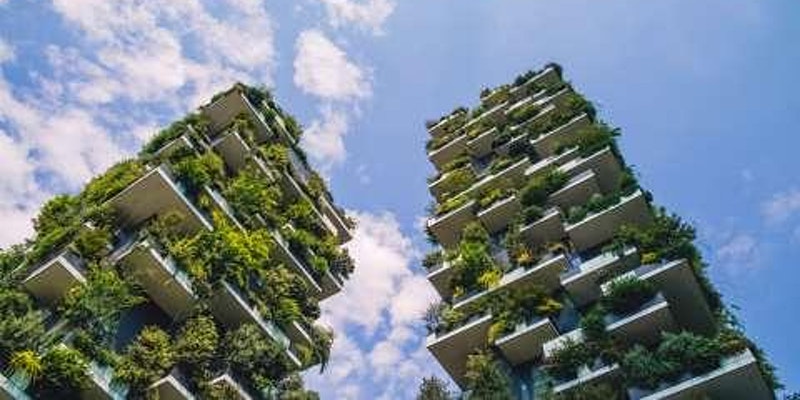 A photo of two buildings with plants.
