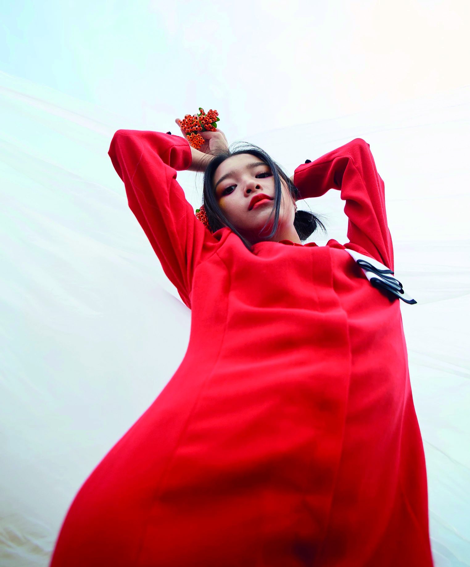 Female model wearing red boiler suit