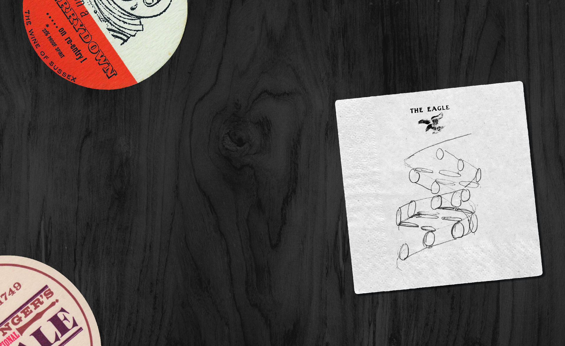 The Eagle beermats on table