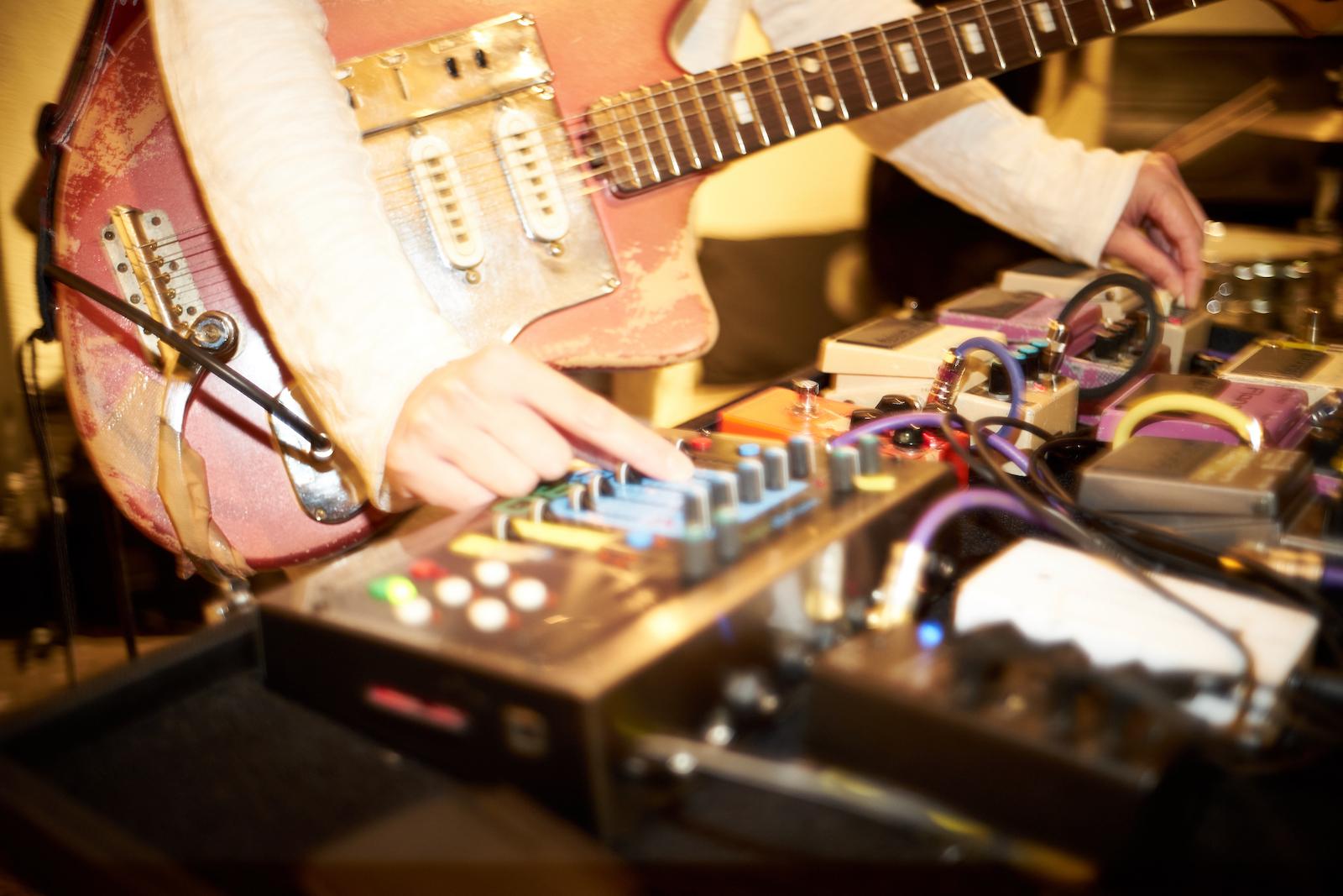 Guitar and sound desk.